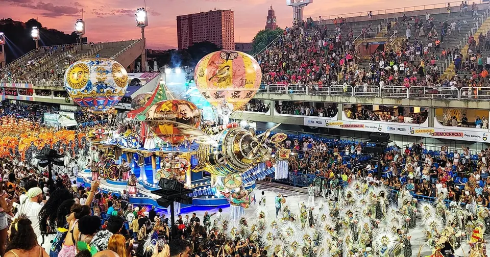A wide view of the parade avenue during a samba parade at night